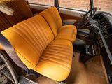 an old car with a yellow seat and a brown seat