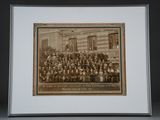 an old photo of a group of people standing in front of a building
