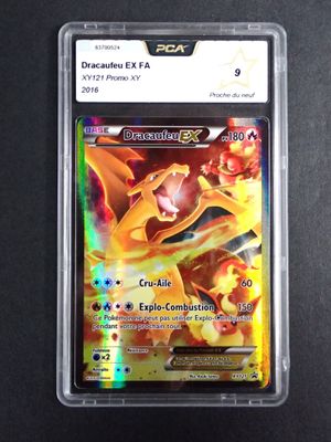 a close up of a pokemon card in a plastic case
