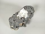 a piece of rock with a white substance on top of it