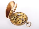 an image of a gold pocket watch with a chain on a white background