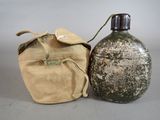 a bottle and bag sitting next to each other on a table