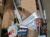 a cardboard box full of books and other items