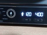 a clock that is on the side of a microwave