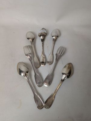 five silver spoons and two silver spoons on a white surface
