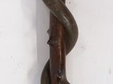 a picture of a metal object on a white surface