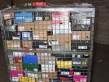 a metal cart with many boxes on it in a warehouse