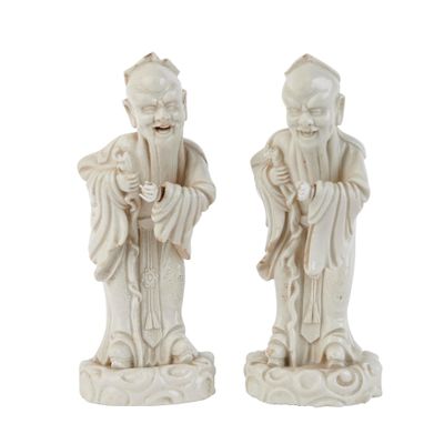 pair of chinese figurines of a man and a woman