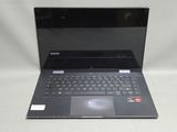un ordinateur portable noir avec un clavier noir posé sur une surface blanche