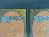 two decks of magic the gathering are shown on a table