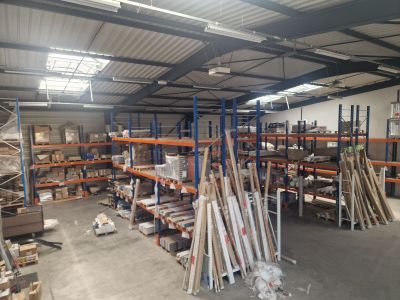 a large warehouse filled with lots of shelves and pallets