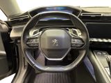 the interior of a car with a steering wheel and dashboard controls