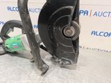 a close up of a chainsaw sitting on top of a table