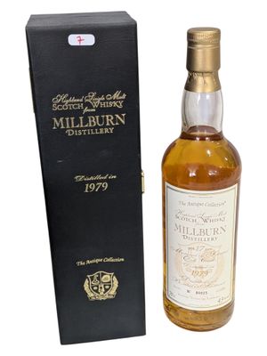 a bottle of whisky with a box on a white background