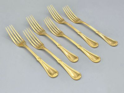 a set of six gold plated forks and spoons