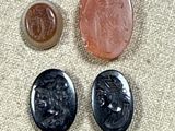 three different types of stones and a penny on a cloth