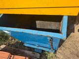 a yellow and blue box sitting on the ground