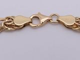 a gold chain bracelet with a clasp on a white background