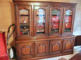 a large wooden bookcase with many books on it