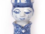 a blue and white vase sitting on a table