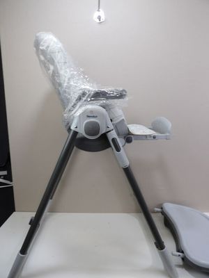 a baby highchair that is wrapped in plastic