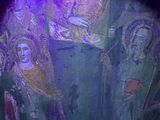 a painting of a group of people standing in a cave