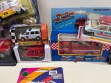a lot of toy cars and trucks on the table