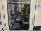 a machine that is sitting inside of a machine shop