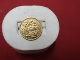 an image of a gold coin sitting on top of a white box