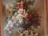 a picture of a painting of flowers in a vase on a table