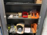 a metal cabinet with many items in it
