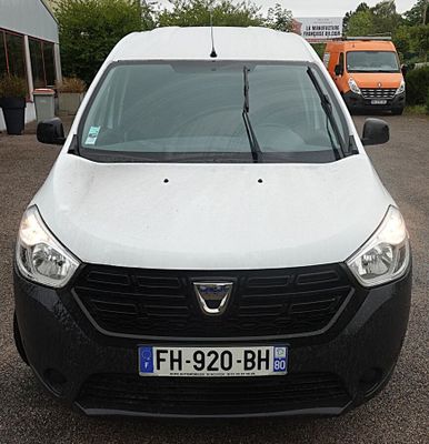 a white van that is parked in a parking lot