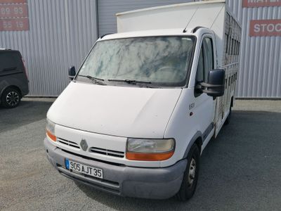 a white van parked in front of a building
