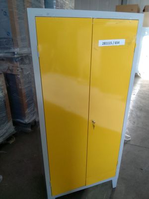 a yellow cabinet in the middle of a warehouse