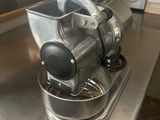 stainless steel counter top with a blender and a bowl on it