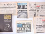 several old french newspapers are displayed on a white surface