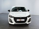 the front view of a white car parked in a showroom