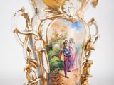 a vase with a picture of a man and a woman on it