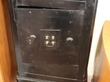 a black stove with a tv on top of it