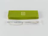 a green box with a spoon in it and a green box with a spoon in it