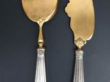 pair of silver and gold plated serving utensils