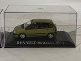 display case for a model of a small green car in a clear box
