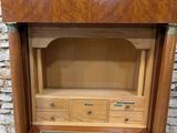 an image of a wooden display case with drawers and drawers