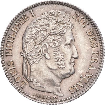 Gros plan sur une pièce de monnaie portant le visage d'un homme