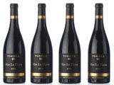 six bottles of red wine lined up in a row