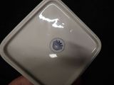 a white plate with a blue and white design on it