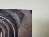 a picture of a man riding a horse in a tunnel