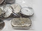 many different types of pocket watches in a bag
