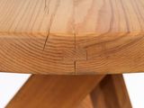 a close up of a wooden table with a piece of wood on it