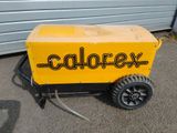 a yellow box with a black wheel on it